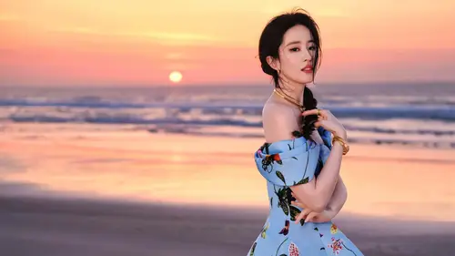 1920x1080 Desktop Wallpaper - 刘亦菲海边日落印花裙写真电脑壁纸